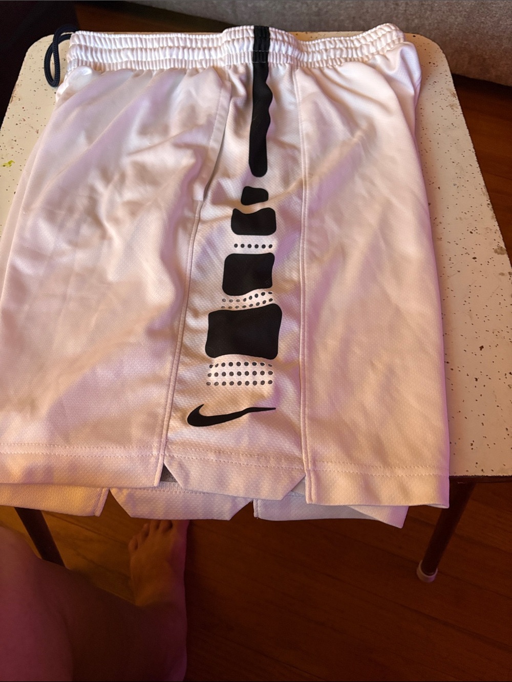 Nike White Athletic Shorts with Black Graphic and Logo